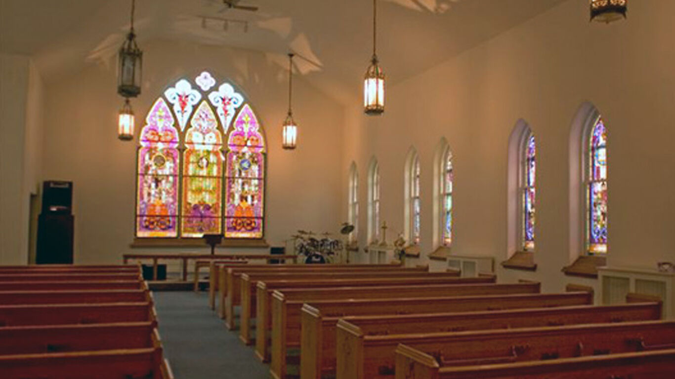 York County Council Of Churches interior facing the pews and stained glass window.