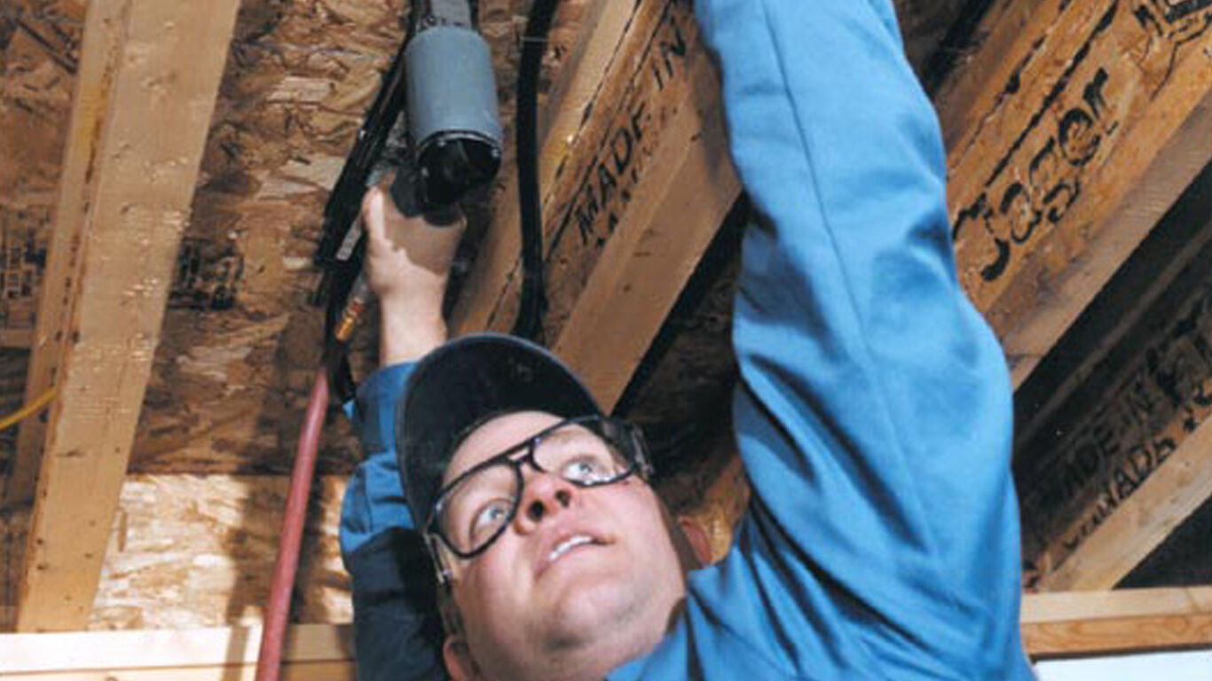 Man installing watts materials