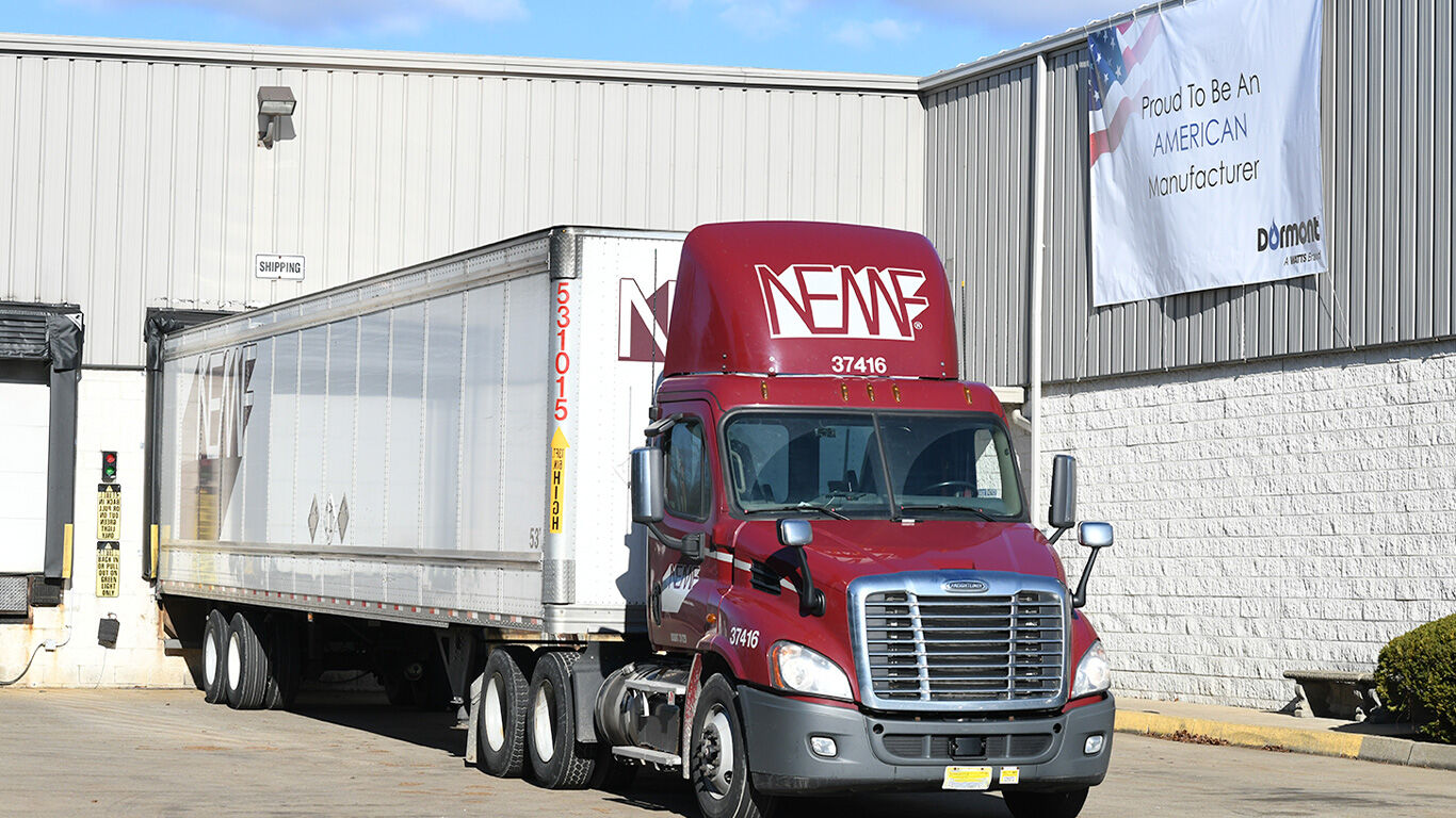 Semi truck parked at a loading dock. 